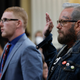 Stephen Ayres (L), who entered the U.S. Capitol illegally on January 6, 2021, and Jason Van Tatenhove (R), who served as national spokesman for the Oath Keepers and as a close aide to Oath Keepers founder Stewart Rhodes, are sworn-in during the seventh hearing by the House Select Committee to Investigate the January 6th Attack on the U.S. Capitol in the Cannon House Office Building on July 12, 2022, in Washington, DC.